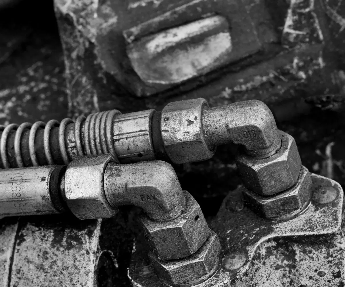 Machined metal parts and valve springs in close detail.